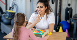 Teacher and student doing speech therapy