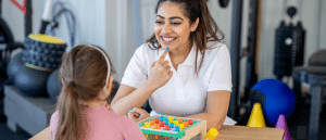 Teacher and student doing speech therapy