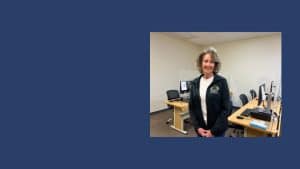 woman standing in front of computers